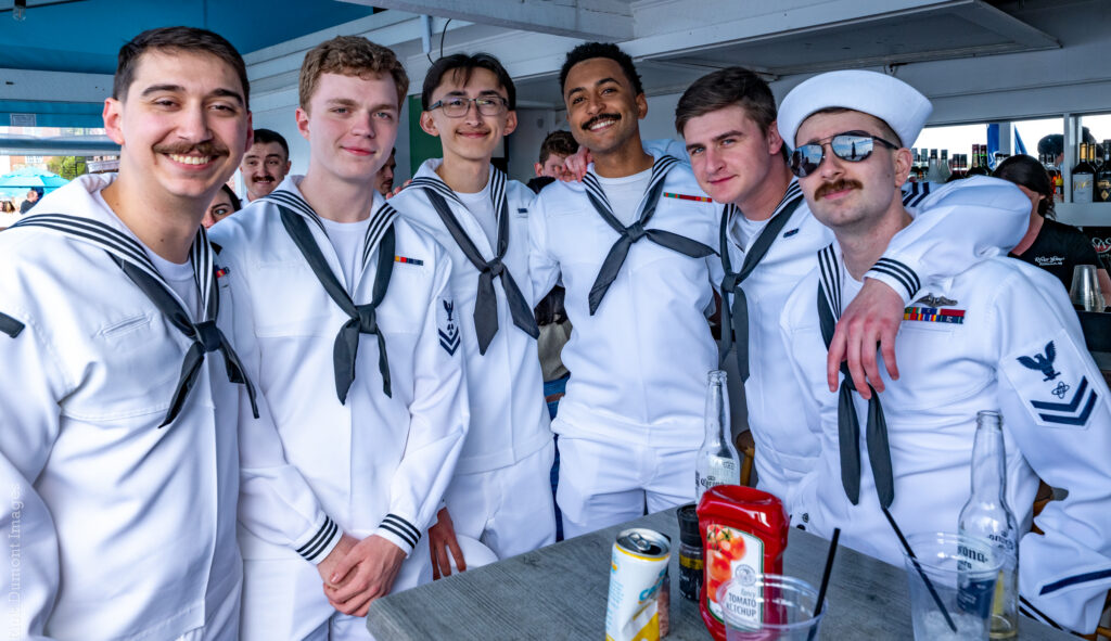 Group celebrating Hit the Decks in nautical outfits