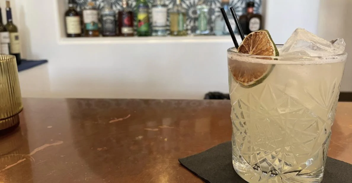Citrus-garnished cocktail on a restaurant bar