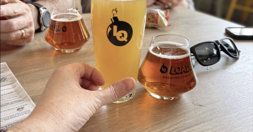 Guests enjoying amber beers at Loaded Question Brewing Co. in Portsmouth, New Hampshire