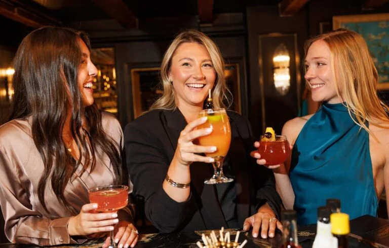 Friends enjoying seasonal cocktails at a Seacoast restaurant