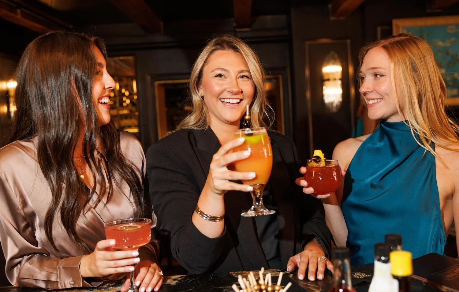 Friends enjoying seasonal cocktails at a Seacoast restaurant