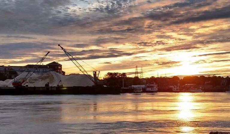 Portsmouth working waterfront and road salt piles at sunset